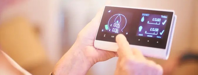 lady using smart energy reader