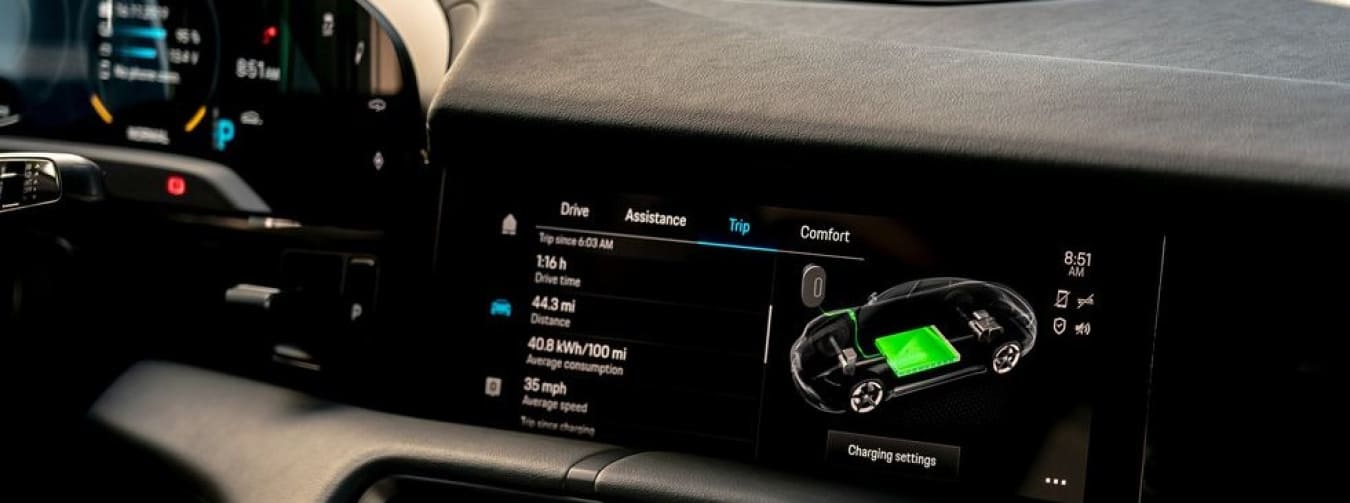 inside of an electric vehicle showing charging status on dash display