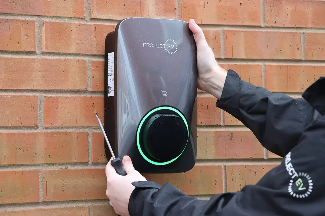 Project EV APEX on wall being fitted by electrician